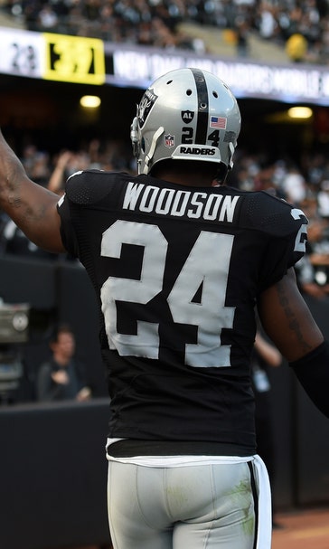 Charles Woodson makes $250K for picking off Geno Smith